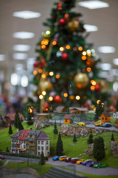 Model of an eco ethno village in a smaller scale in front of a Christmas tree