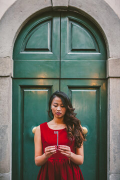 Mysterious Young Asian Woman Holding an Old Key