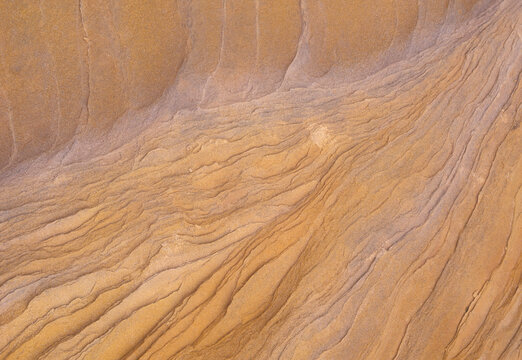 closeup of bands colors striations strata in sandstone formations in desert Southwest arizona