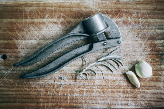 Wooden board with garlic and rosemary