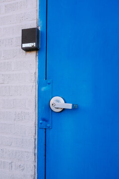 Blue door and intercom box