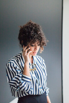 Young modern woman having a phone call.