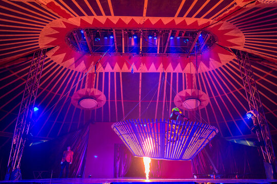 Circus daredevil riding above jet of flame