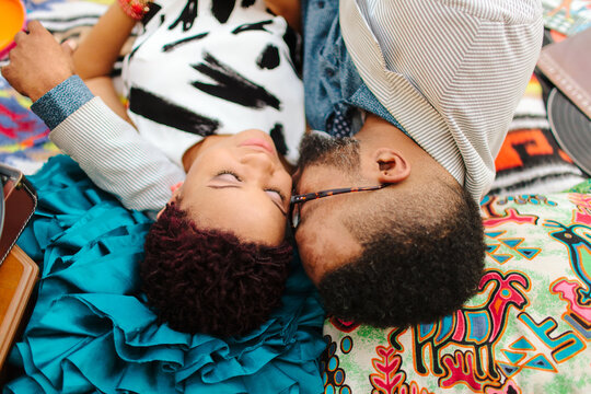 An affectionate ethnic couple, enjoying a beautiful day outdoors