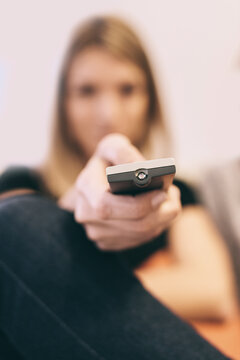 Woman Using a TV Remote Control