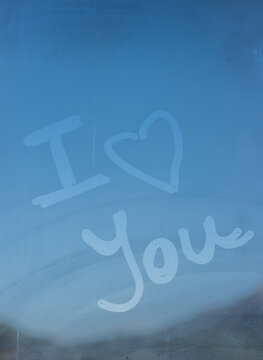 I love you"" written on a fogged glass