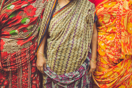 Three Woman Dressed in Saris