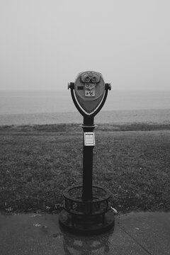 Binocular telescope camera on a foggy beach during the winter months in Maryland