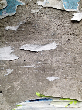 Torn Paper on Plastered Wall Background