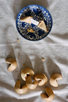 Fortune cookies and message reading ""love"" on table