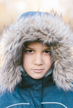 Cute Boy in Winter Hat Looking At Camera