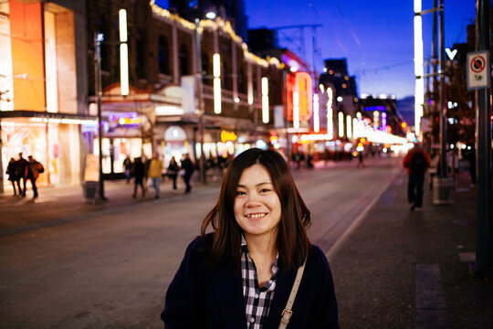 Asian Woman In Downtown Vancouver At Night