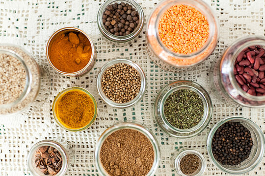 Spices and dry goods in glass jars shot from above