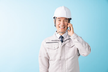 ビジネスマン　作業服　電話