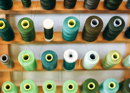 Many spools of green thread