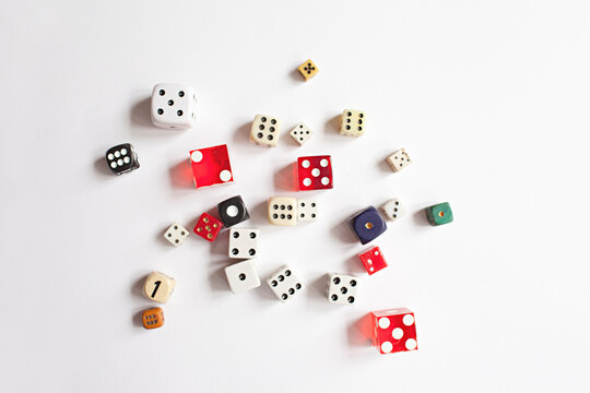 a collection of vintage dice scattered on a white background