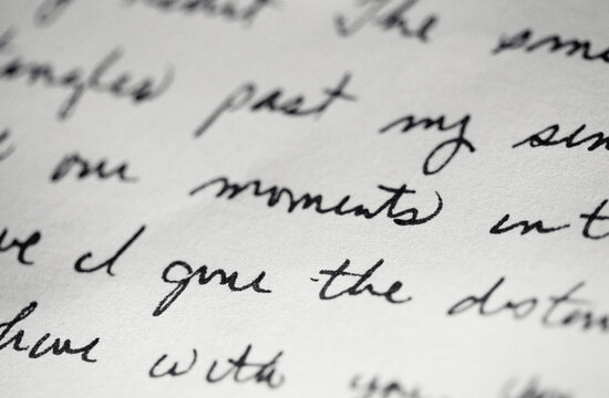 A letter written in cursive - focus on the word moments