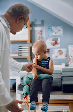 Pediatrician Examining a Boy