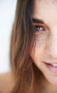 half portrait of a beautiful freckled woman