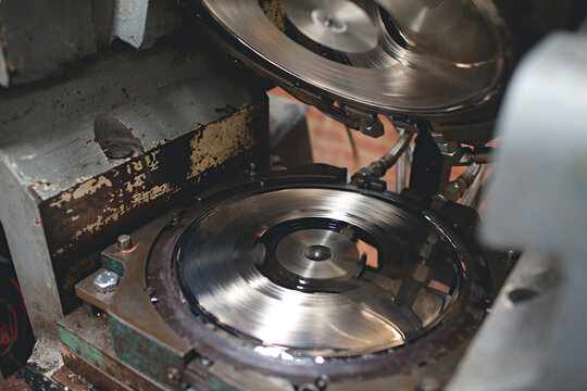 close up of machinery used to press vinyl records