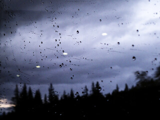 Rain drops accumulate on a window on the Alaska Railroad.