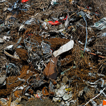 Scrap metal junkyard with pile of rusty iron