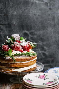 Genoise sponge filled with cream and topped with strawberry's.
