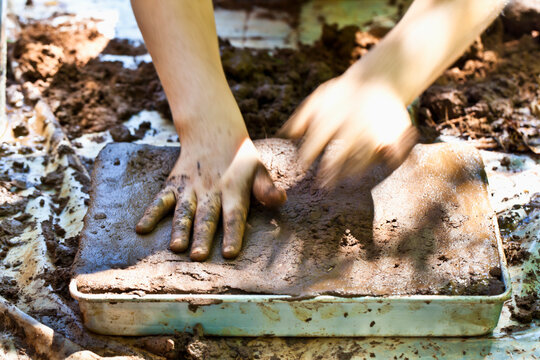 Child Playing in Mud