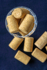 Wine bottle corks in a crystal glass.