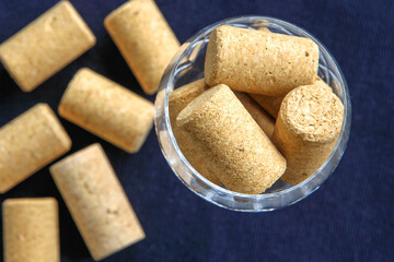 Wine bottle corks in a crystal glass.