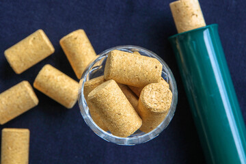 Wine bottle corks in a crystal glass.