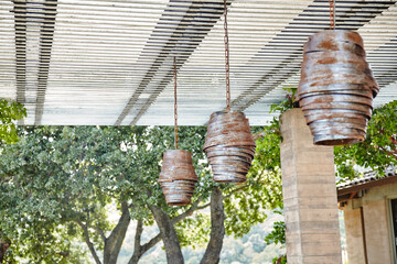 Custom metal light fixtures outdoors in garden