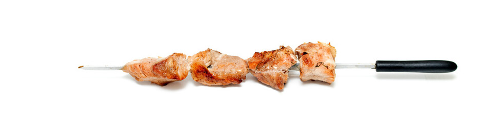 Pieces of fried kebab meat isolated on white background.