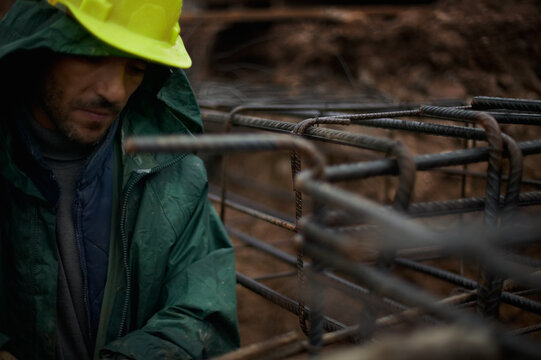 Mason working with a foundation construction