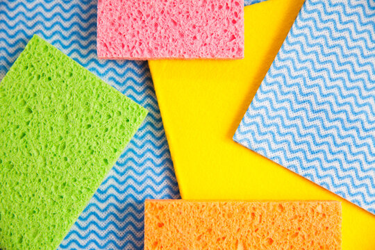colourful sponges and cleaning clothes ready for spring cleaning