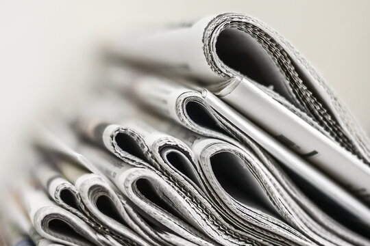 A stack of newspapers in an office