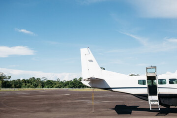 The back of a small plane with an open door.