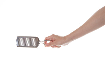 hand holding cheese grinder.