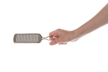 hand holding cheese grinder.