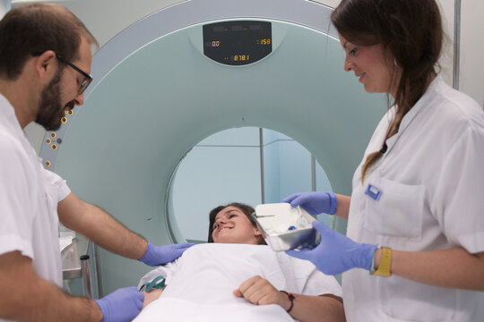 Medical staff and young patient prepared for the scann