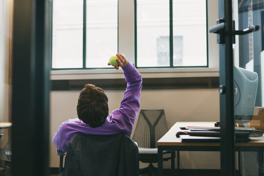 Office: Man Tossing Ball In Office To Waste Time
