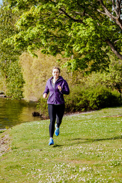Female runner running in a park