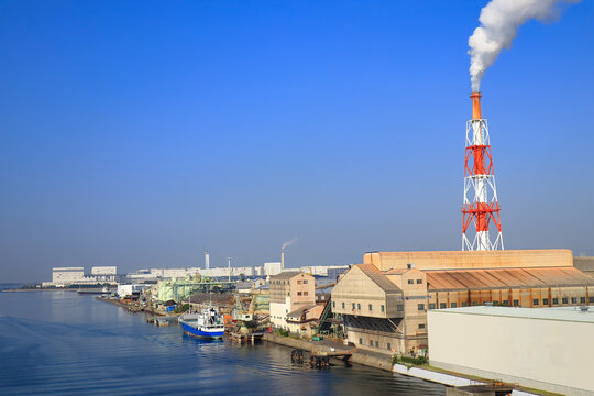 Cargo Hold Japan Coastal Ship is moored at  Industrial port  surrounded by factory buildings on Osaka Bay,Japan.