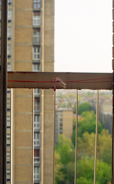 Two clothespin's on a red wire