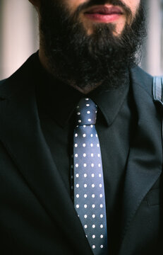 Young Hip Businessman in Suit wit Polka Dot Tie