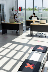 The rows of chairs in the waiting area for office jobs were banned from sitting, marked with a physical cross symbol due to the coronavirus.