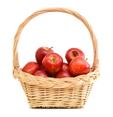 ripe apples in basket on a white background