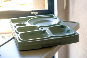 Empty hospital food tray at room of hospital in front of window