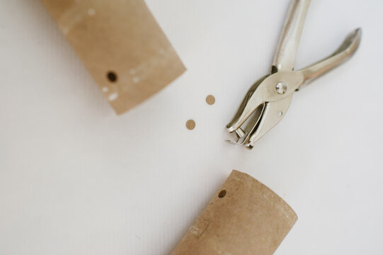 Showing step of where to punch holes for DIY binoculars