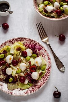 Mixed salad with cherries, pecan nuts and mozzarella cheese